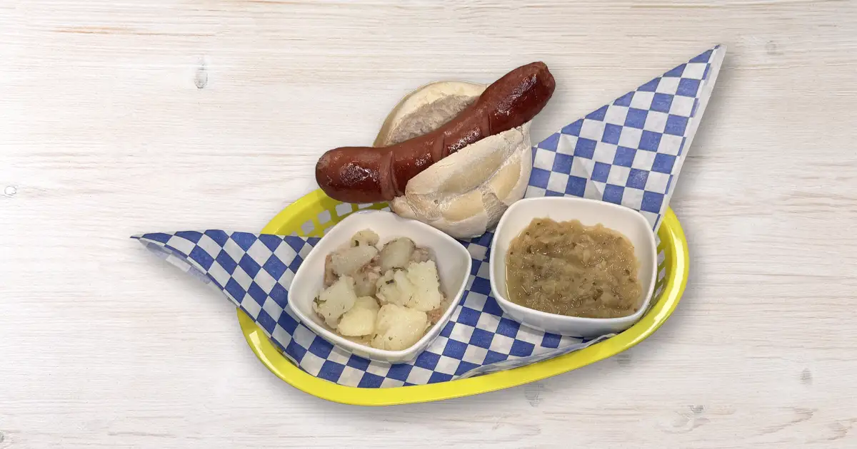 Knackwurst on brochten with sides of potatoes and saurrkraut